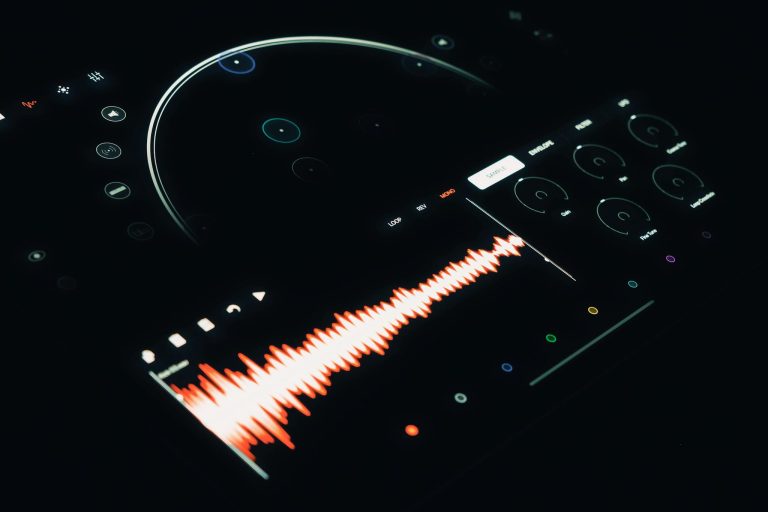 Close-up of a digital audio interface displaying a vibrant sound wave and control elements.
